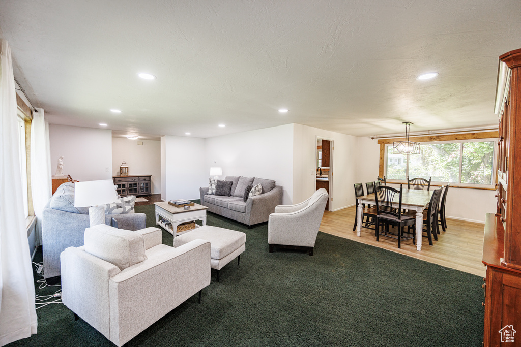 Living room featuring recessed lighting and dark wood finished floors