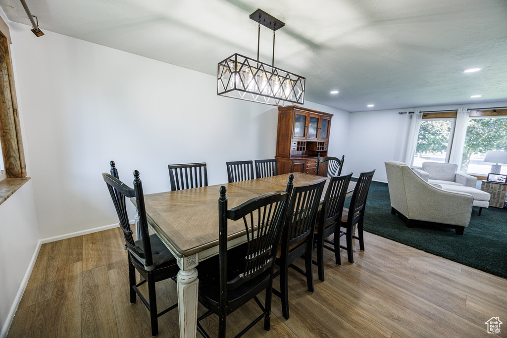 Dining room featuring wood finished floors, recessed lighting, and baseboards