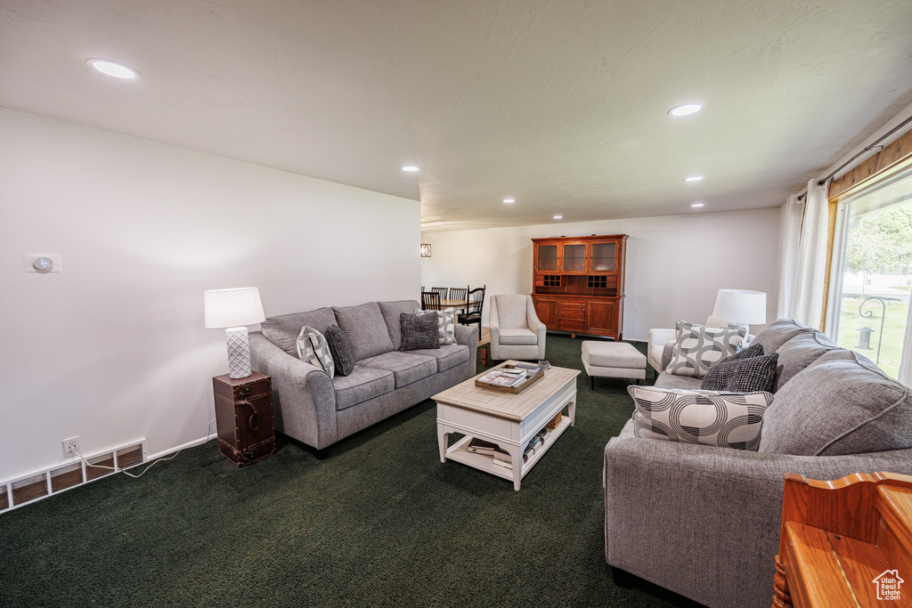 Living room with carpet floors and recessed lighting