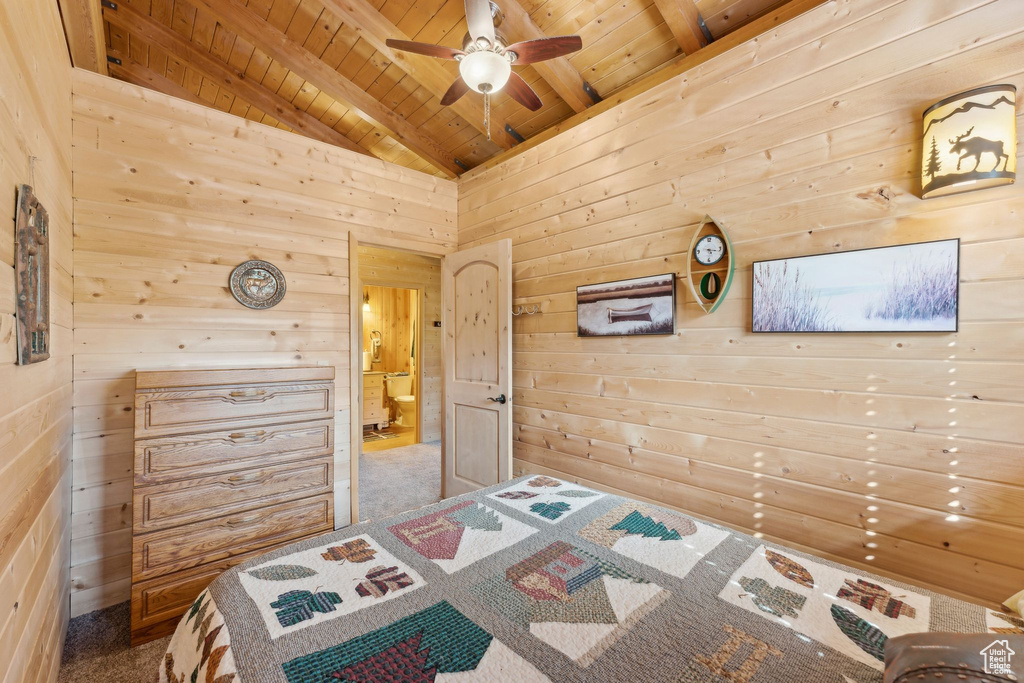 Bedroom with wood ceiling and wooden walls