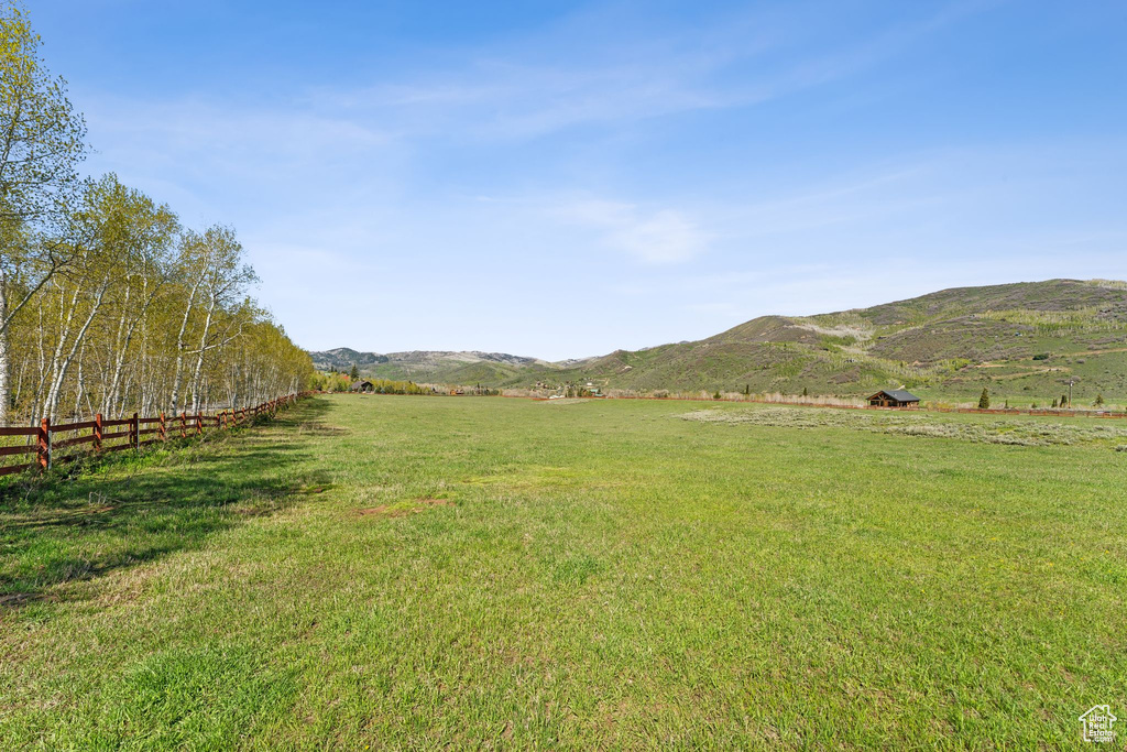 View of yard featuring a view of countryside and a mountain view