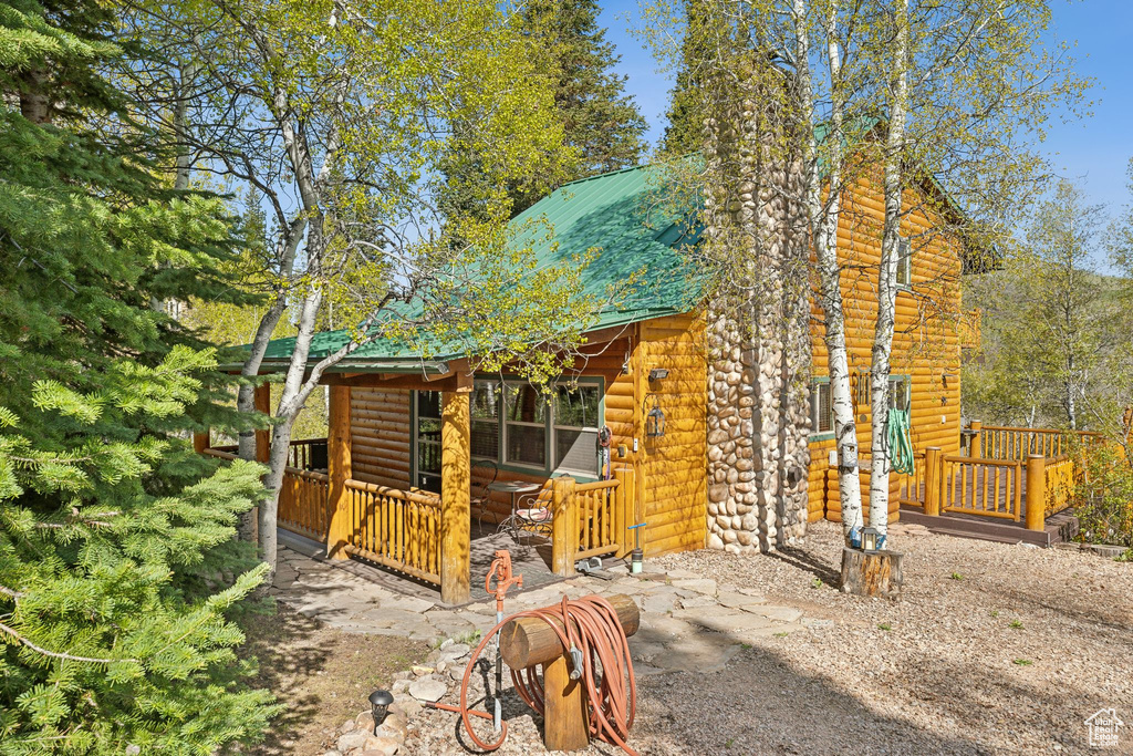 View of front of house with log veneer siding