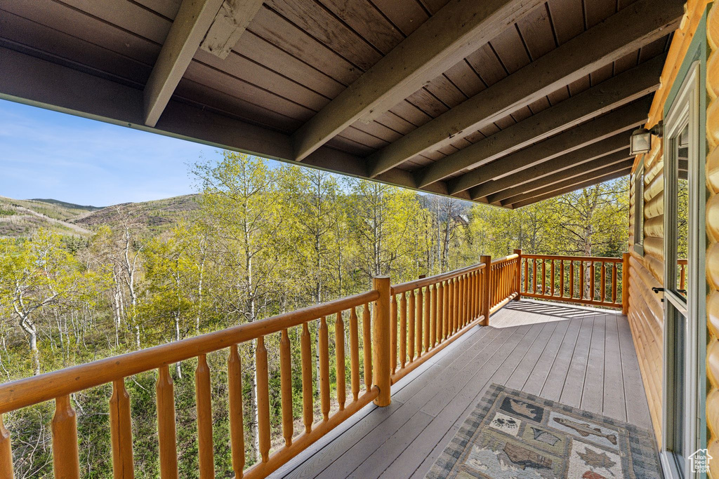 Deck featuring a view of trees