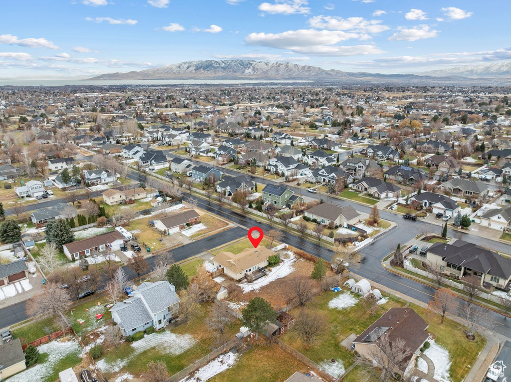 View of property location with a mountain backdrop and nearby suburban area