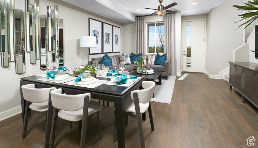 Dining room with baseboards, dark wood-style floors, recessed lighting, and a ceiling fan
