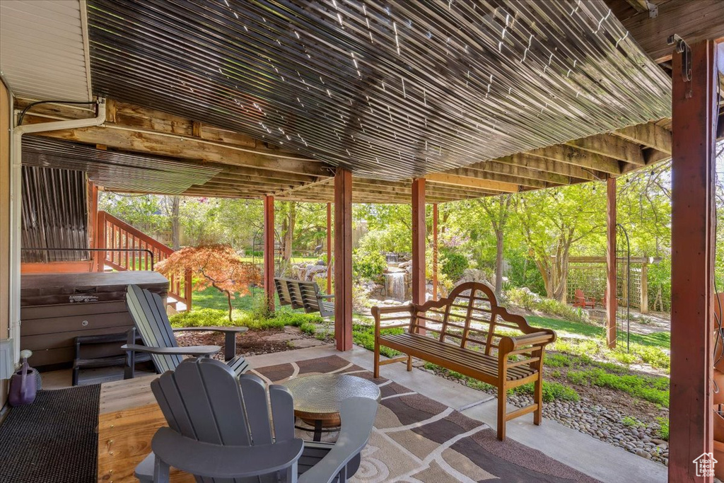 View of patio featuring a hot tub