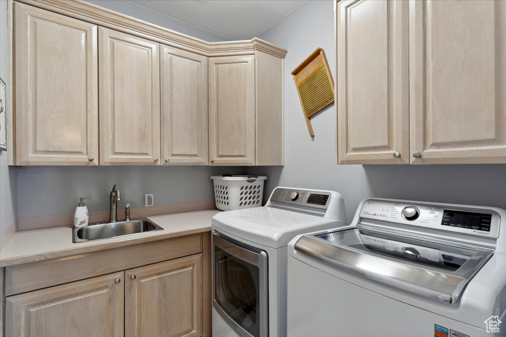 Washroom with cabinet space and independent washer and dryer