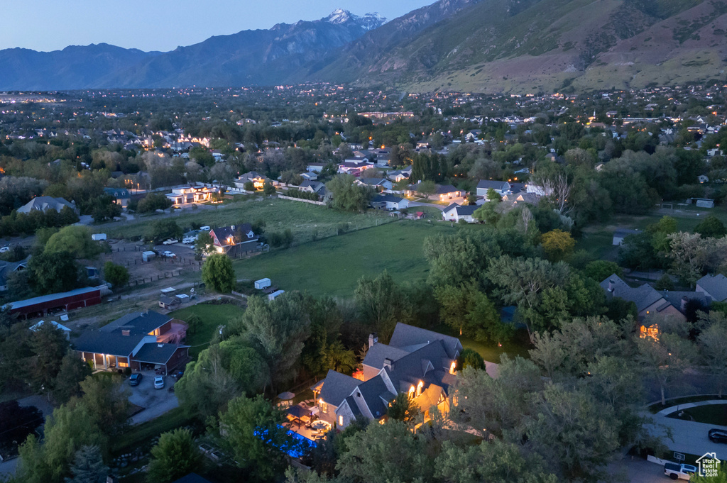 Aerial view of property's location featuring a mountain backdrop