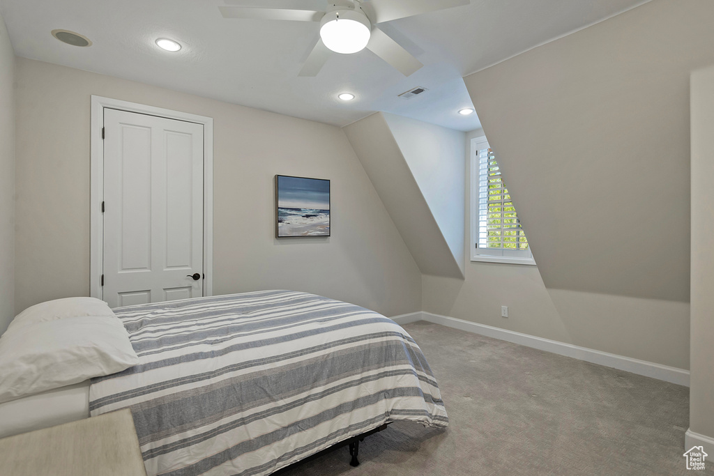 Carpeted bedroom with baseboards, a ceiling fan, and recessed lighting