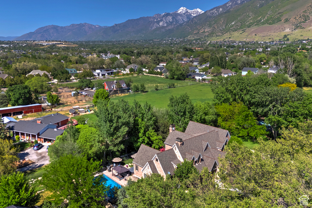 View of property location with mountains and nearby suburban area