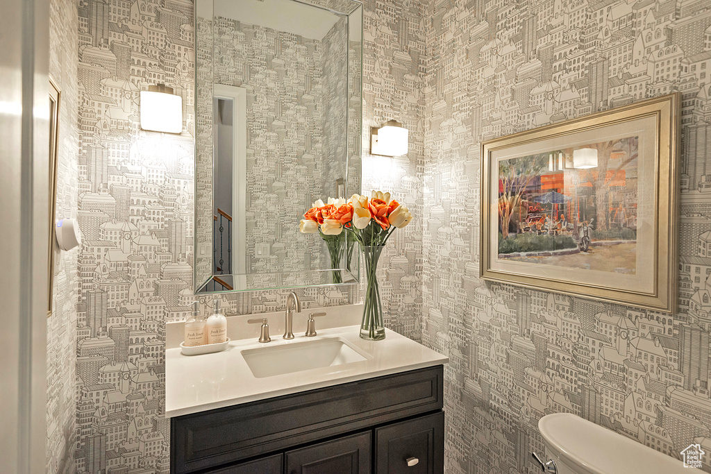 Bathroom featuring vanity and toilet