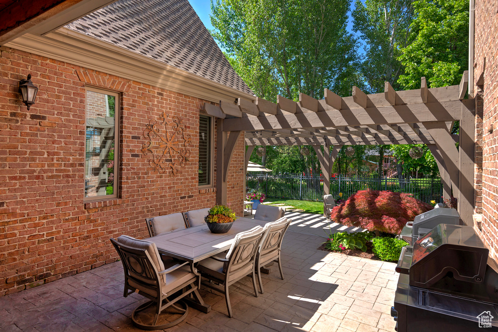 View of patio / terrace featuring outdoor dining space and a pergola