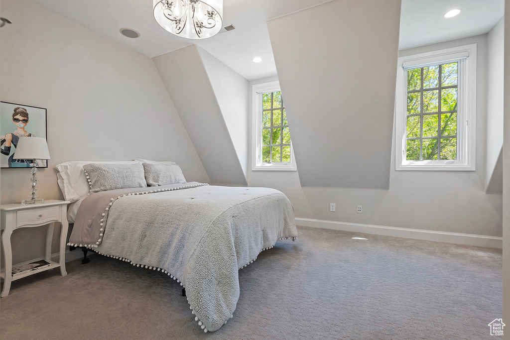 Bedroom with baseboards, carpet flooring, a chandelier, recessed lighting, and lofted ceiling