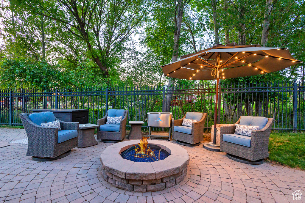 View of patio / terrace featuring an outdoor living space with a fire pit
