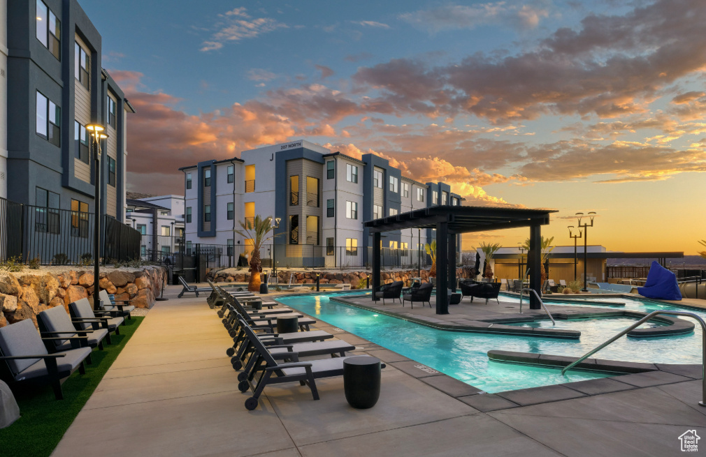 Community pool with a jacuzzi and a patio area