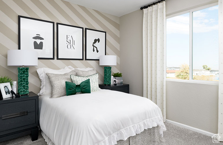 Bedroom with carpet and baseboards