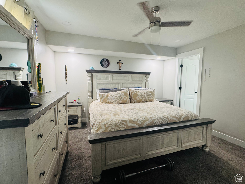 Bedroom with dark carpet, baseboards, ceiling fan, and recessed lighting