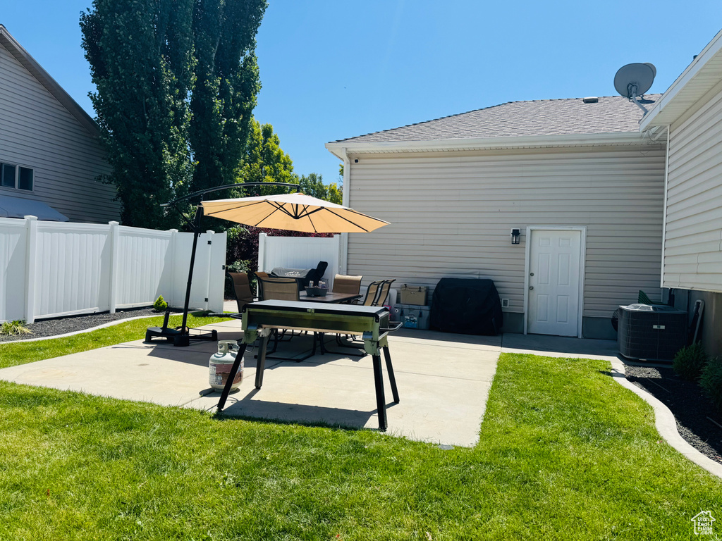 View of patio with central AC unit