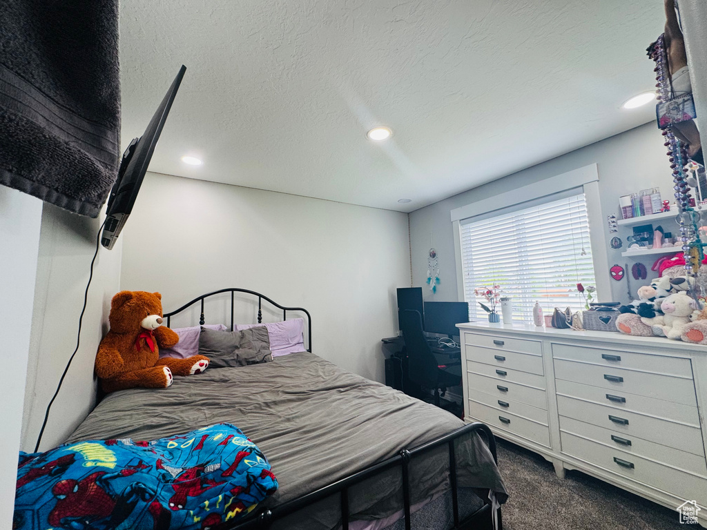 Carpeted bedroom featuring recessed lighting