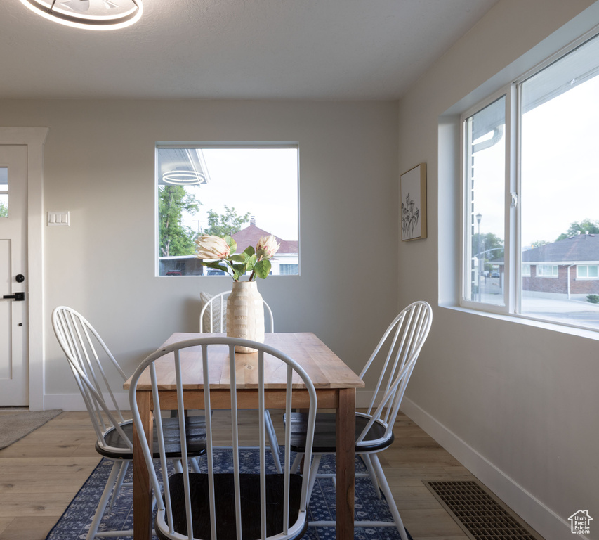 Dining room featuring light wood-style floors and baseboards