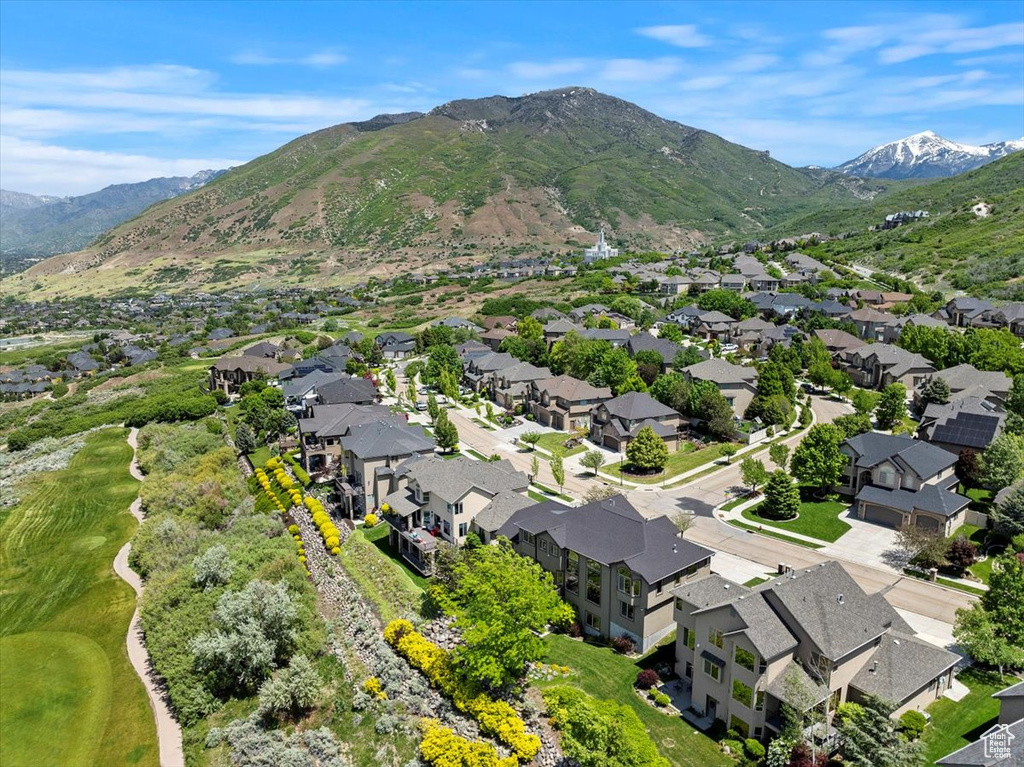 Aerial perspective of suburban area featuring a mountainous background