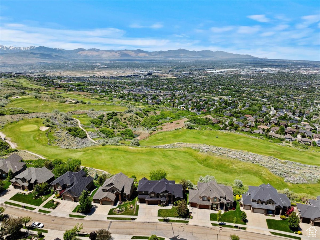 View of property location with a mountain backdrop, nearby suburban area, and a local golf course