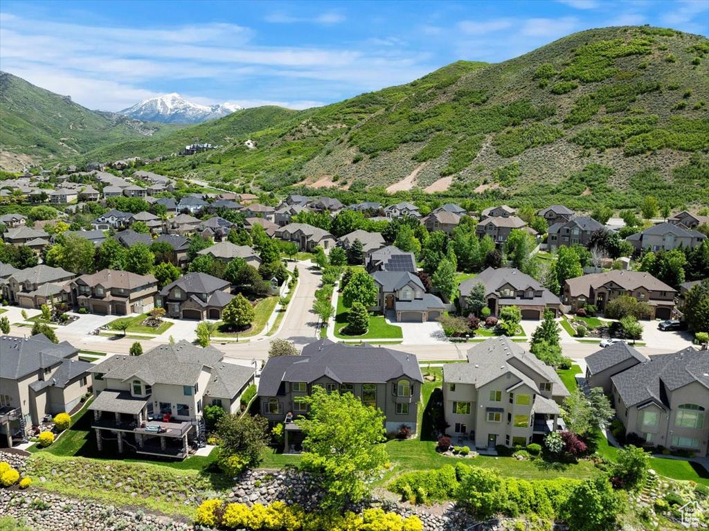 Aerial view of residential area featuring a mountain backdrop