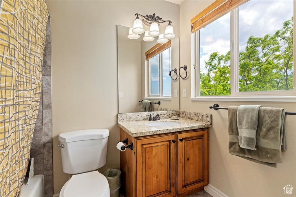 Full bathroom featuring vanity and toilet