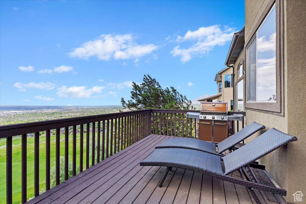 Deck with area for grilling and a lawn