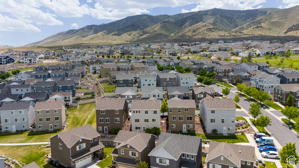 Aerial view of residential area featuring a mountain backdrop