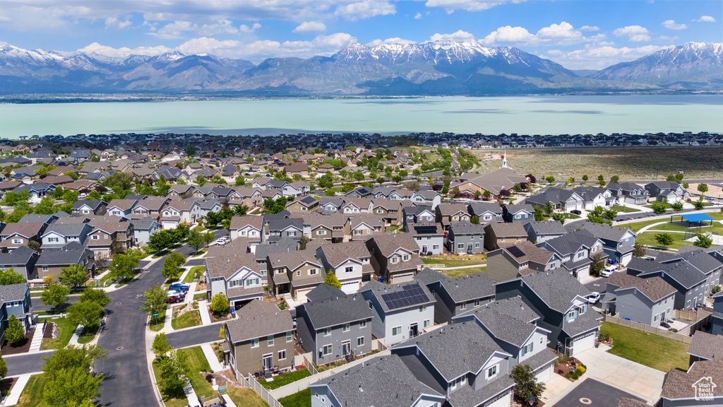 Aerial view of residential area featuring a water and mountain view