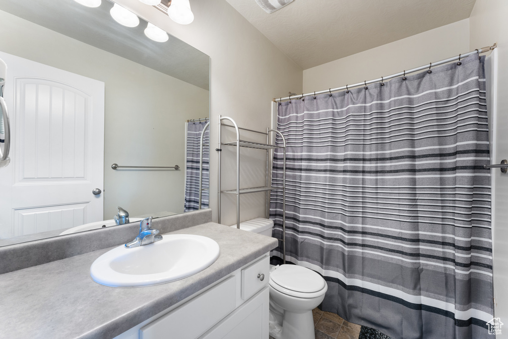 Bathroom with toilet and vanity