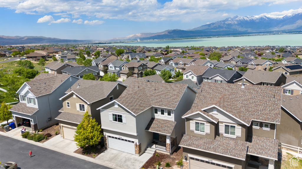 Aerial perspective of suburban area with a water and mountain view