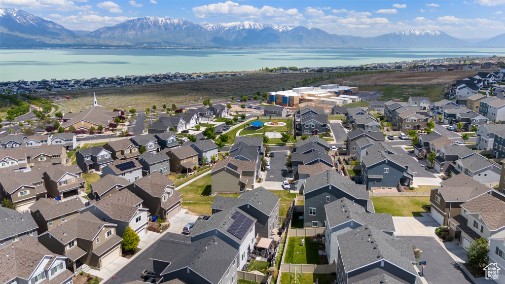 Aerial perspective of suburban area featuring a water and mountain view