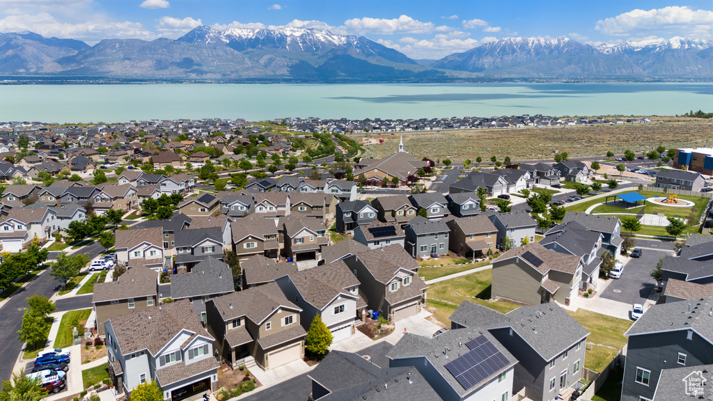 Aerial perspective of suburban area with a water and mountain view