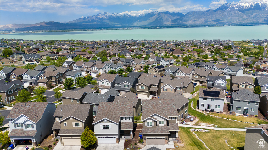 Aerial perspective of suburban area with a water and mountain view