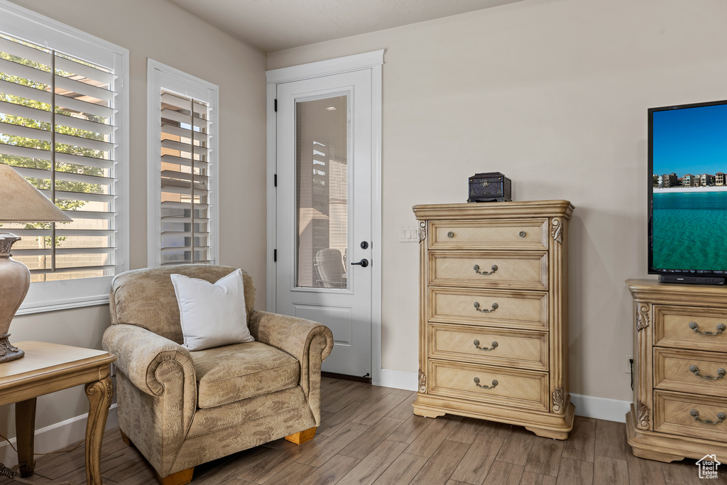 Living area featuring wood finished floors and baseboards