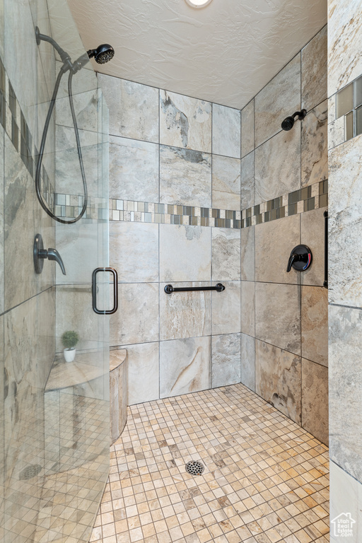 Full bathroom featuring a stall shower