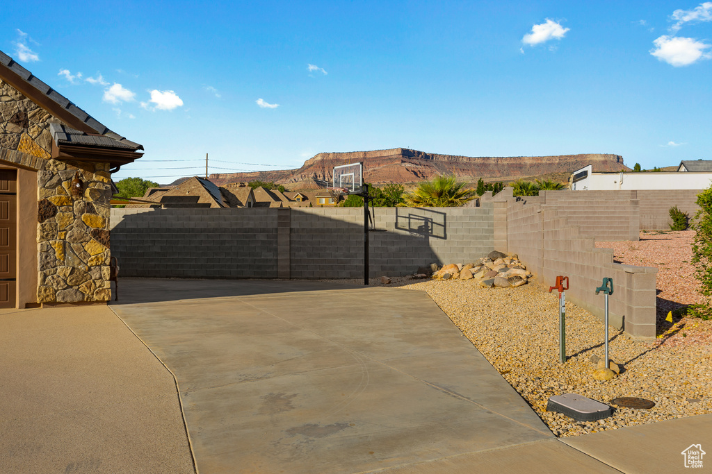 View of yard featuring basketball court and a mountain view