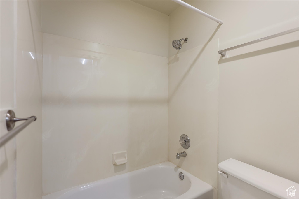 Full bath with toilet and shower / bath combination