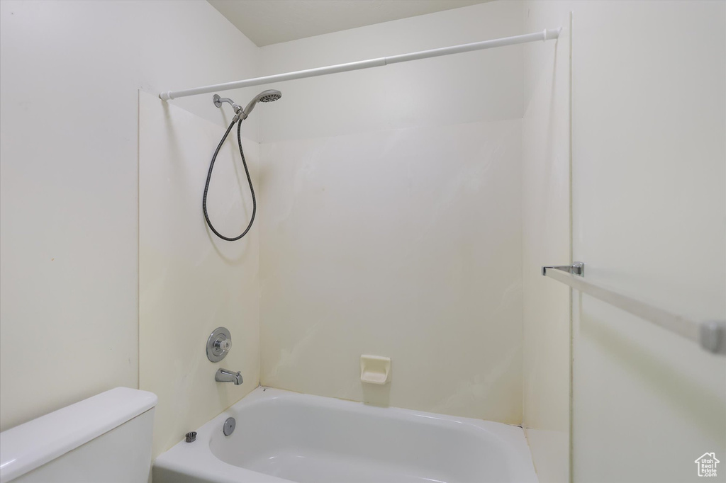 Bathroom featuring toilet and  shower combination