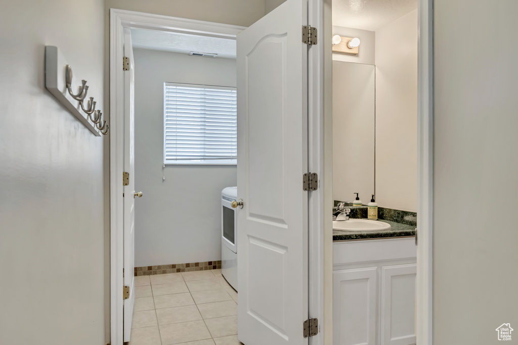Bathroom with vanity and tile patterned flooring