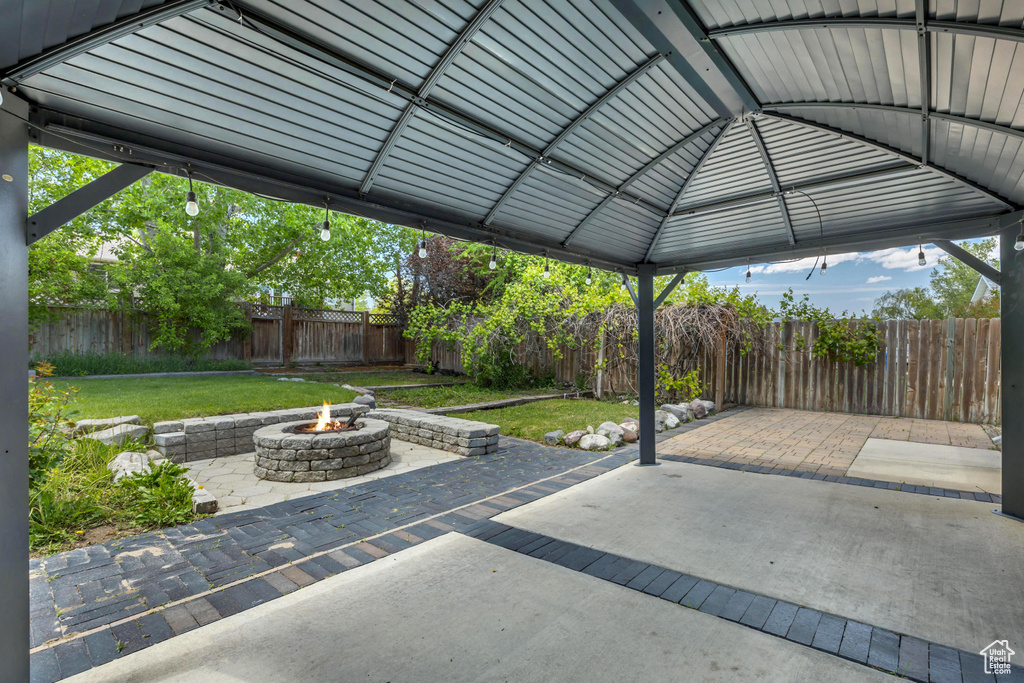 View of patio featuring a fire pit