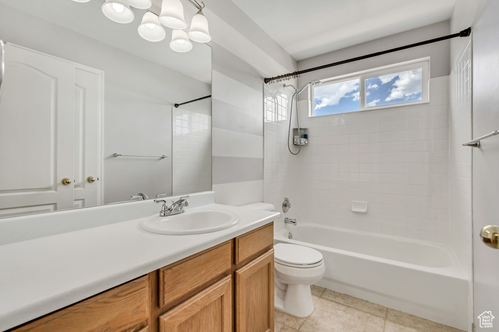 Full bath with toilet, shower / tub combination, vanity, and tile patterned flooring