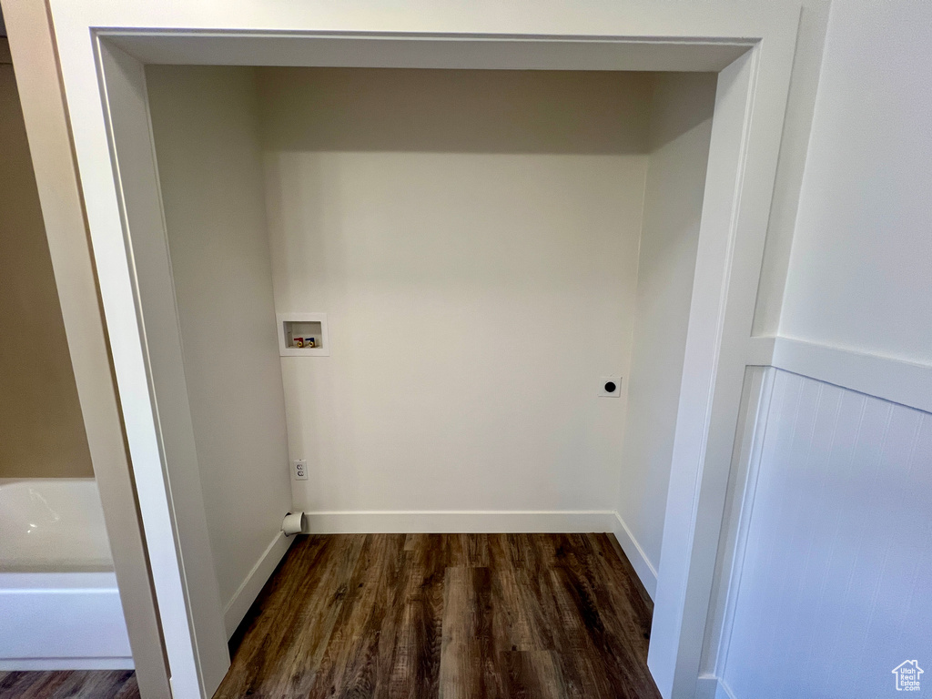 Washroom featuring electric dryer hookup, dark wood-style flooring, baseboards, and hookup for a washing machine