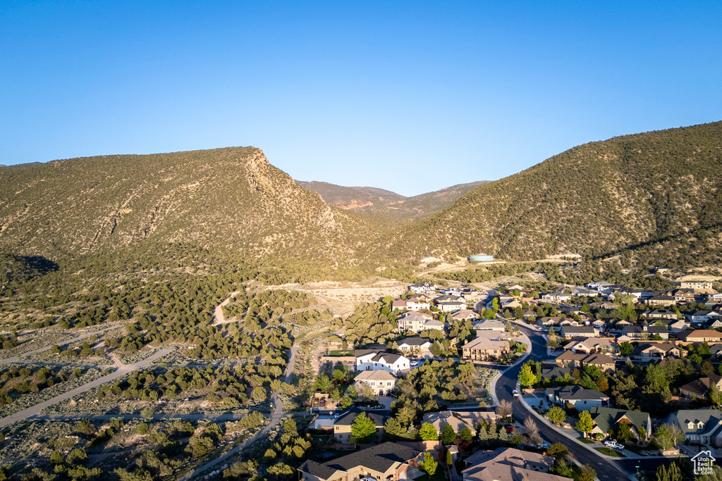 View of mountain backdrop featuring nearby suburban area