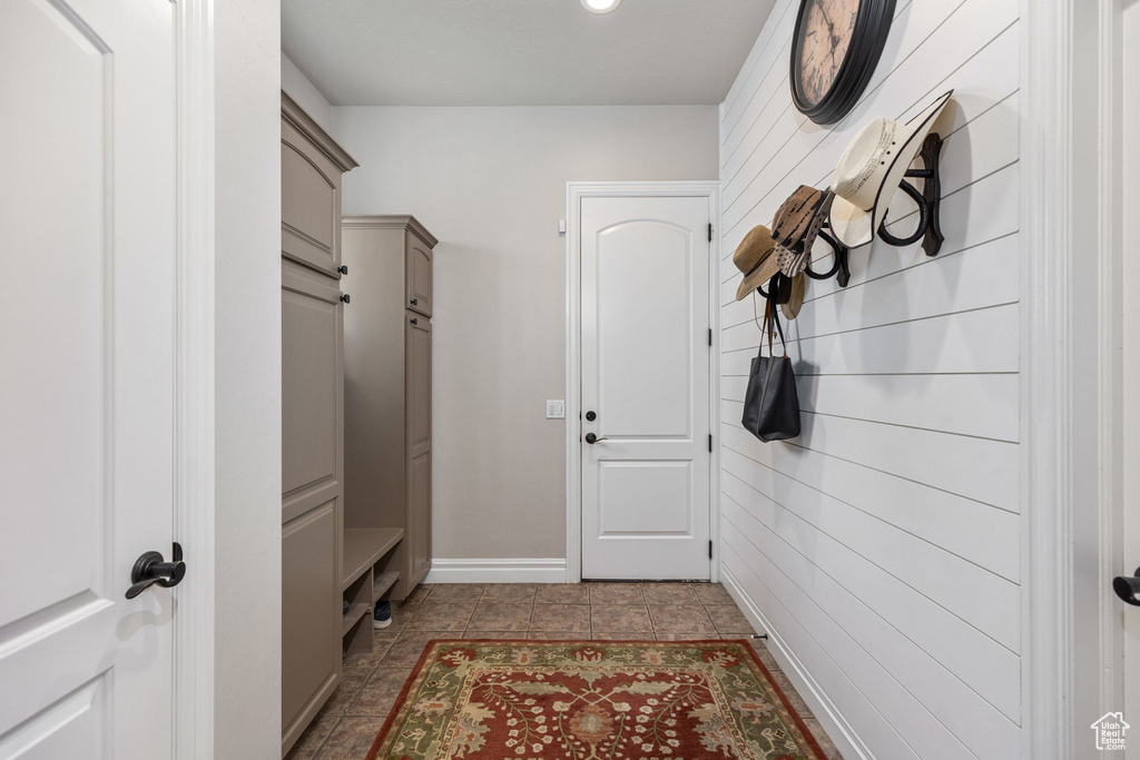 Mudroom featuring baseboards, tile patterned floors, and recessed lighting