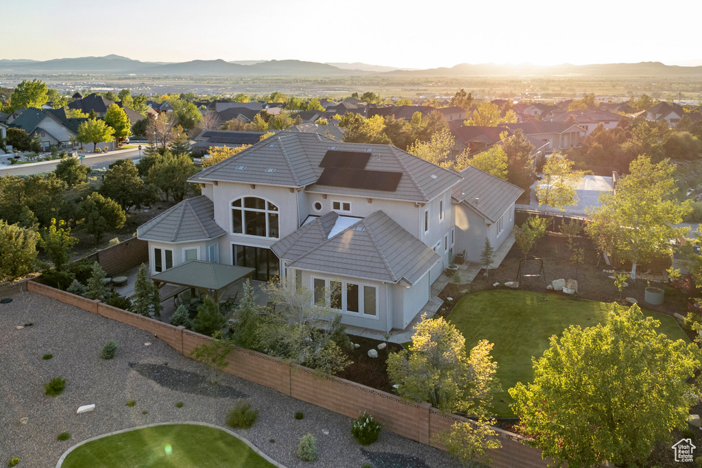 Aerial perspective of suburban area featuring a mountainous background