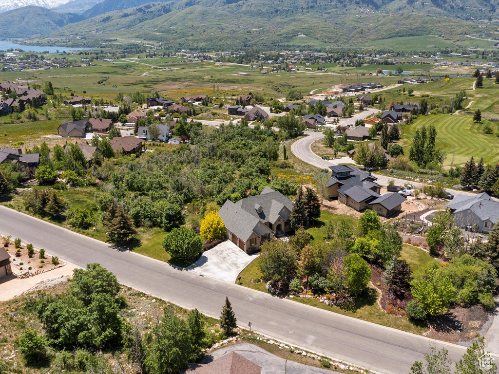 Aerial perspective of suburban area featuring a water and mountain view