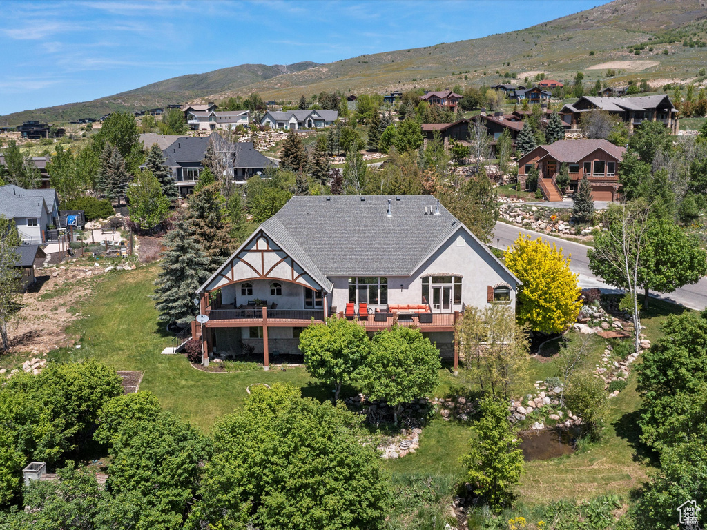 Aerial perspective of suburban area featuring a mountainous background